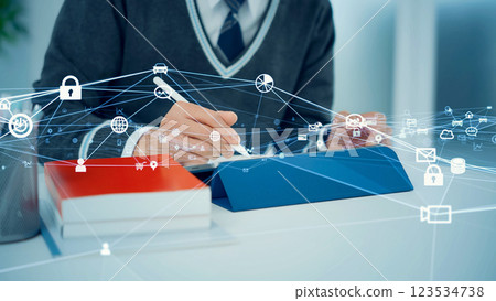 Students studying using tablets and communication network image 123534738
