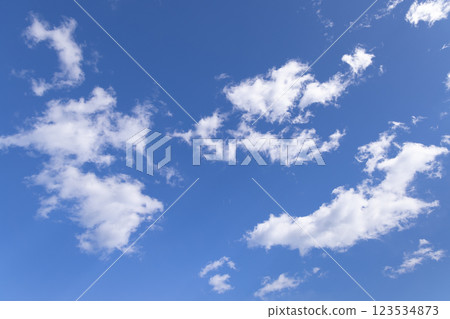 torn clouds floating in the blue sky torn clouds floating in the blue sky 123534873