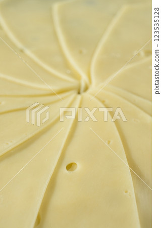 Semi-hard cheese close-up, thin slices Semi-hard cheese close-up, thin slices 123535128