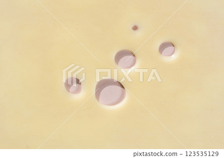 Smooth Yellow Cheese with Characteristic Holes Smooth Yellow Cheese with Characteristic Holes 123535129