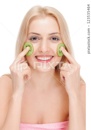 Woman getting fruit cosmetic facial mask Woman getting fruit cosmetic facial mask 123535464