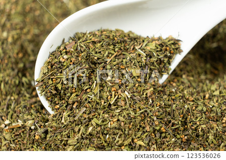 Savory herb seasoning in a spoon macro 123536026