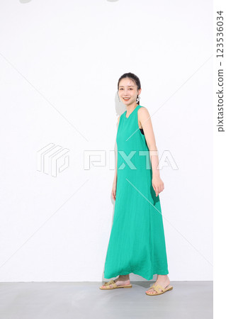 Smiling woman holding a bouquet of sunflowers 123536034