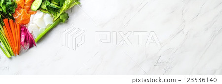 Colorful poke bowl with fresh fish and vegetables displayed on white marble surface in bright tones 123536140