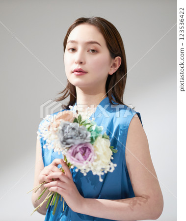 Young woman with a bouquet Young woman with a bouquet 123536422
