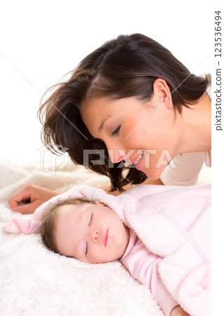 Baby girl sleeping with mother care near Baby girl sleeping with mother care near 123536494