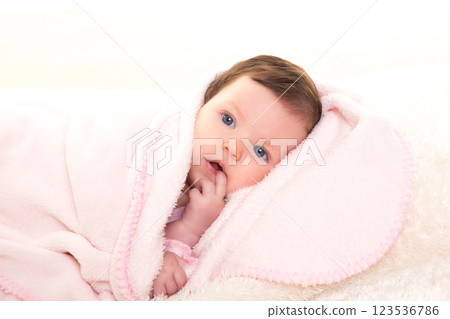 baby girl with toothache in pink with white fur 123536786