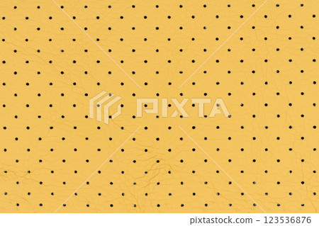 Yellow color abstract artificial leather with small dots and holes pattern for background Yellow color abstract artificial leather with small dots and holes pattern for background 123536876