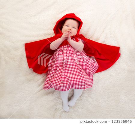 Baby Little Red Riding Hood on white fur 123536946