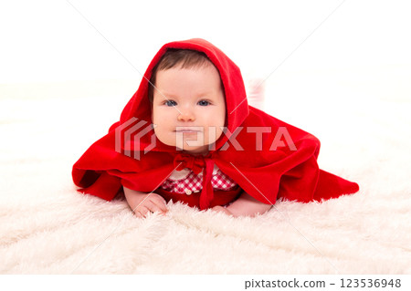 Baby Little Red Riding Hood on white fur 123536948