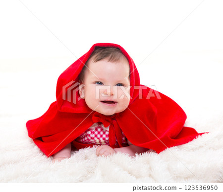 Baby Little Red Riding Hood on white fur Baby Little Red Riding Hood on white fur 123536950