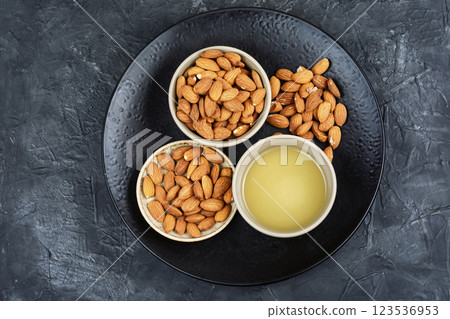 Healthy almond oil and shelled nuts. Healthy almond oil and shelled nuts. 123536953