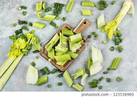 Celery sticks on a wooden board. Celery sticks on a wooden board. 123536960