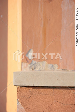 historical architecture vintage plaster in park. wall with cracked red classic style in public park 123537296