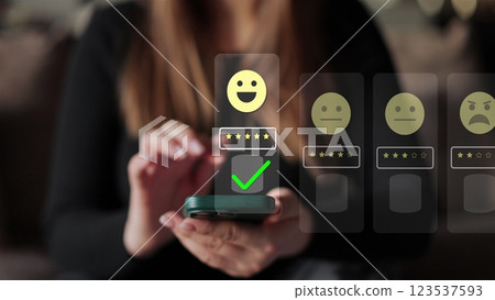 Woman holds smartphone giving good review at cafe. Close up on female hand holding smartphone rating of the quality of service,store, service and social networks. Graphic animation. Woman holds smartphone giving good review at cafe. Close up on female hand holding smartphone rating of the quality of service,store, service and social networks. Graphic animation. 123537593