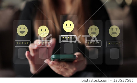Woman holds smartphone giving good review at cafe. Close up on female hand holding smartphone rating of the quality of service,store, service and social networks. Graphic animation. 123537595