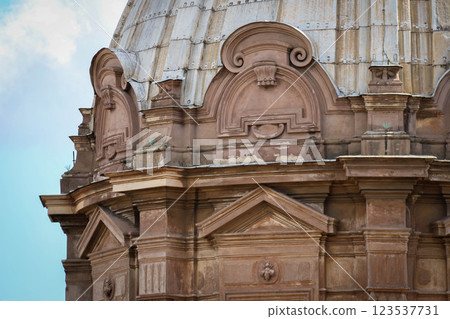 Closeup Ornate Dome featuring intricate Architectural details and Classical design elements. Weathered Stone Patina and craftsmanship highlight historical significance and enduring beauty of structure Closeup Ornate Dome featuring intricate Architectural details and Classical design elements. Weathered Stone Patina and craftsmanship highlight historical significance and enduring beauty of structure 123537731