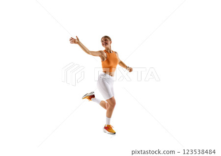 Energetic female sprinter mid-stride, extending arm forward, expressing motion, agility, control, training for peak performance Energetic female sprinter mid-stride, extending arm forward, expressing motion, agility, control, training for peak performance 123538484