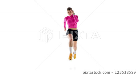 Front view image of concentrated young woman in sportswear, runner in motion, competing, training isolated on white studio background Front view image of concentrated young woman in sportswear, runner in motion, competing, training isolated on white studio background 123538559