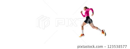 Low angle view of focused young woman, runner in sportswear in motion, running, training isolated on white studio background Low angle view of focused young woman, runner in sportswear in motion, running, training isolated on white studio background 123538577