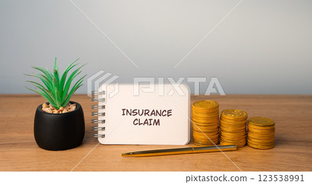 Insurance claim concept. Formal request made by a policyholder to an insurance company for compensation or coverage based on the terms of their policy. Business and finance. Notes with coins Insurance claim concept. Formal request made by a policyholder to an insurance company for compensation or coverage based on the terms of their policy. Business and finance. Notes with coins 123538991