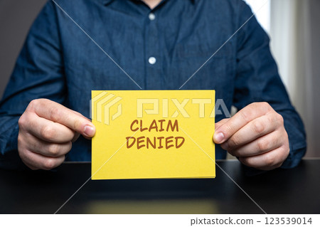 Claim denied concept. Request for payment, reimbursement, or benefits has been rejected by the responsible party, such as an insurance company, government agency, or employer. Man and notes 123539014