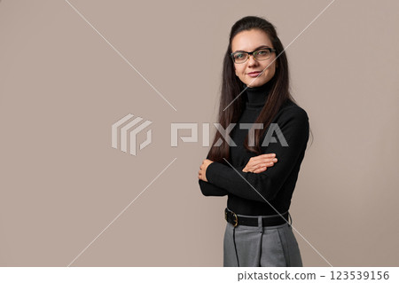 freelancer businesswoman lady with crossed arms wear eyeglasses isolated on grey background freelancer businesswoman lady with crossed arms wear eyeglasses isolated on grey background 123539156