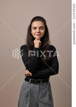 pretty businesswoman lady with crossed arms isolated on gray background pretty businesswoman lady with crossed arms isolated on gray background 123539163
