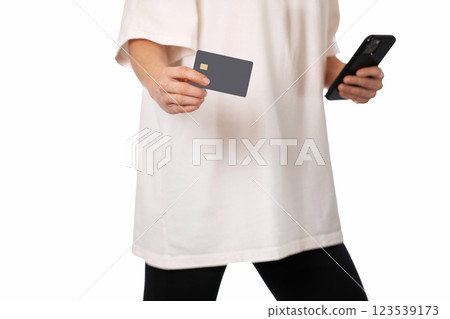 woman with mobile phone and black premium credit bank card on white background. Online shopping. woman with mobile phone and black premium credit bank card on white background. Online shopping. 123539173