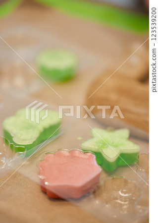 green and pink handmade soap in plastic mold green and pink handmade soap in plastic mold 123539200