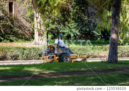 In the city park, a special car with an employee In the city park, a special car with an employee 123539320