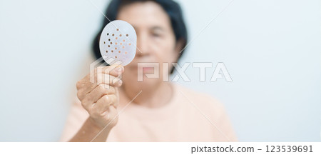 Elderly Woman with eye protective shield after eye surgery. Eye disease, Cataract, Glaucoma, Age Related Macular Degeneration, Diabetic Retinopathy, Vitreous, Lasik, World Glaucoma day and health Elderly Woman with eye protective shield after eye surgery. Eye disease, Cataract, Glaucoma, Age Related Macular Degeneration, Diabetic Retinopathy, Vitreous, Lasik, World Glaucoma day and health 123539691
