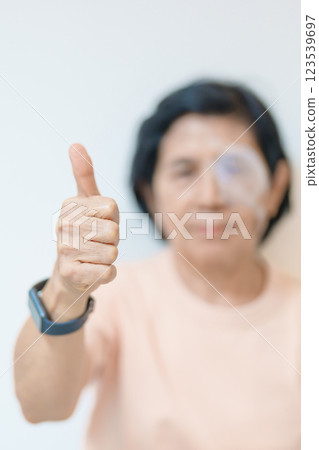 Elderly Woman with eye protective shield after eye surgery. Eye disease, Cataract, Glaucoma, Age Related Macular Degeneration, Diabetic Retinopathy, Vitreous, Lasik, World Glaucoma day and health Elderly Woman with eye protective shield after eye surgery. Eye disease, Cataract, Glaucoma, Age Related Macular Degeneration, Diabetic Retinopathy, Vitreous, Lasik, World Glaucoma day and health 123539697