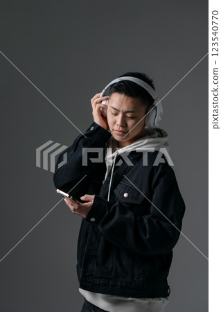 Male, teenage, casual, headphones 123540770