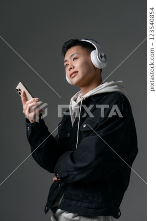 Male, teenage, casual, headphones Male, teenage, casual, headphones 123540854