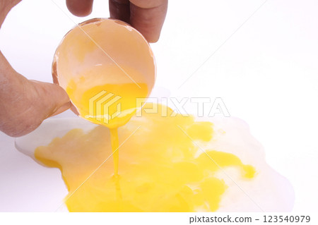 man's hand holding Egg half open on white background. One egg cracked. with clipping path. top view man's hand holding Egg half open on white background. One egg cracked. with clipping path. top view 123540979