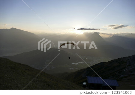 Panoramic view with paraglider from Nordlinger hut on Karwendel Hohenweg, Austria 123541063