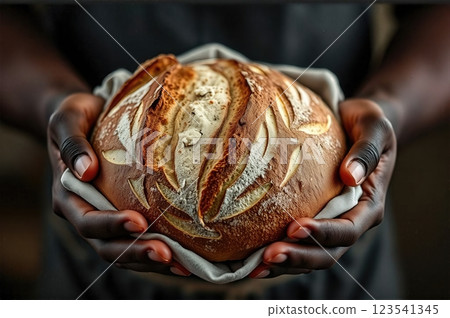 The Artisan's Pride A Masterfully Scored Sourdough bread Creation Presented in Traditional Baker's Cloth 123541345