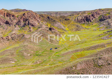 An off-road tourist trip to the mountains of Almaty. picnic on four-wheel drive cars in the steppe 123541427
