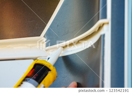 Applying silicon on caravan body Applying silicon on caravan body 123542191