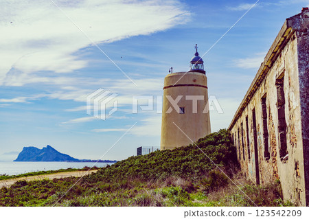 Lighthouse and Gibraltar rock, La Alcaidesa, Spain. 123542209