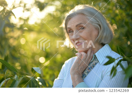 Portrait of a beautiful elderly woman in the park 123542269