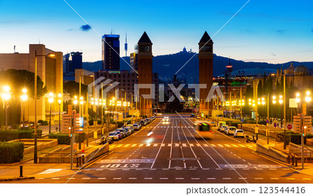 Lighted Avinguda de la Reina Maria Cristina with Venetian Towers in Barcelona in summer evening 123544416
