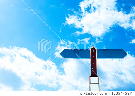 Landscape with left and right vector arrows in blue sky 123544587