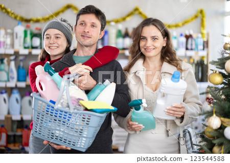 Portrait of family with full shopping basket in supermarket before christmas Portrait of family with full shopping basket in supermarket before christmas 123544588