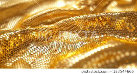 Shimmering golden fabric drapes elegantly, capturing light in a captivating display of texture and color 123544666