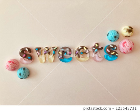 Chocolate covered sweets letters and ice cream 123545731