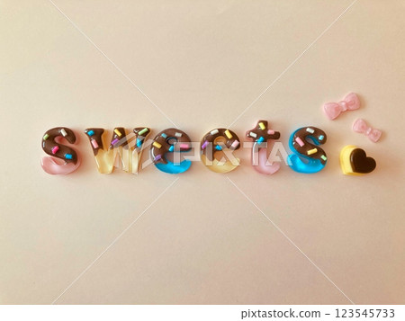 Chocolate covered sweets letters and pudding 123545733