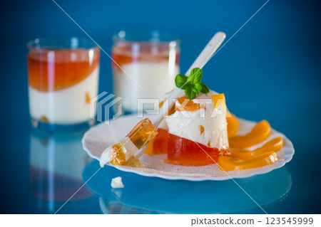 Portioned jelly dessert with yogurt cream and fruits 123545999