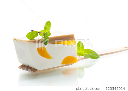 pieces of fruit inside milk fruit jelly on white background 123546014
